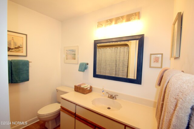 bathroom with vanity and toilet