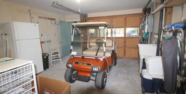 garage featuring white refrigerator