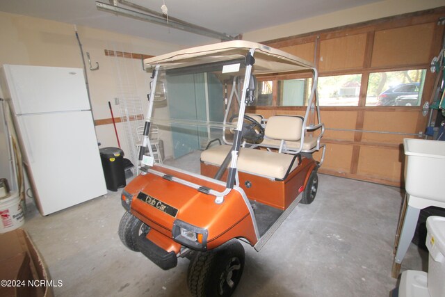 garage featuring white fridge