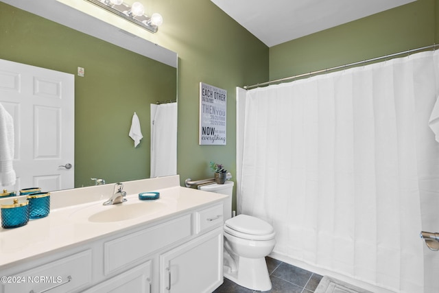 bathroom featuring a shower with shower curtain, vanity, toilet, and tile patterned floors