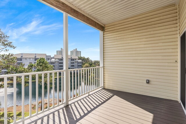 balcony featuring a water view