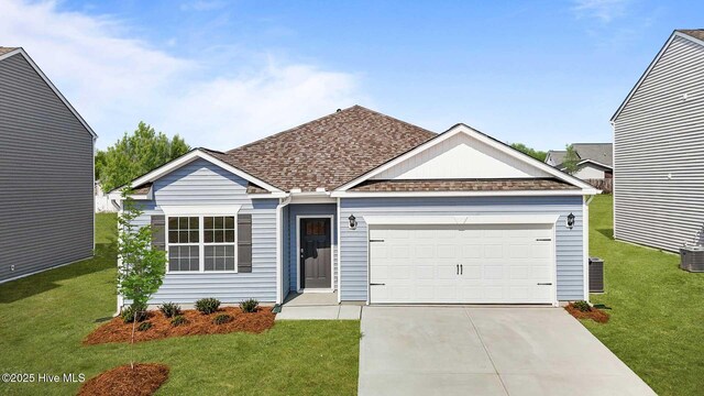 ranch-style home featuring a front yard and a garage