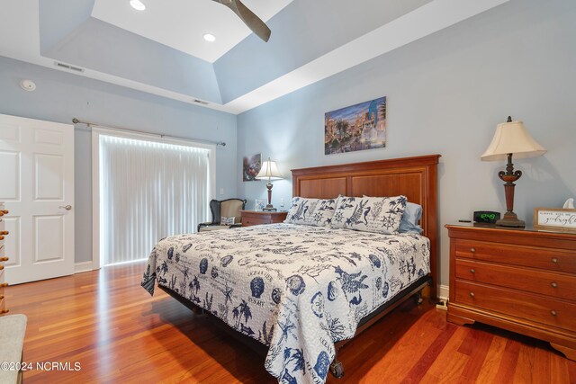 bedroom with ceiling fan and dark hardwood / wood-style floors