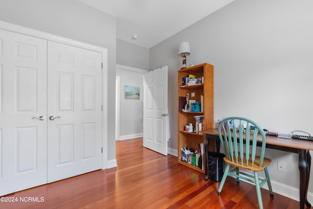 office area with hardwood / wood-style flooring and built in desk