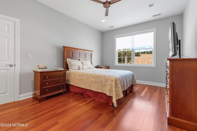 bedroom with wood-type flooring and ceiling fan