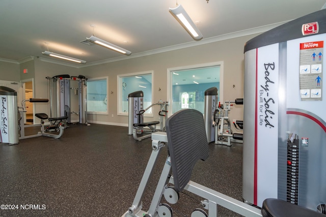 workout area with crown molding