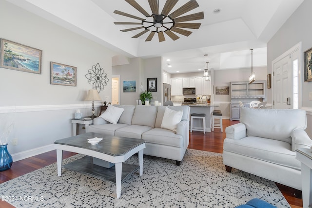 living room featuring ceiling fan and light hardwood / wood-style floors