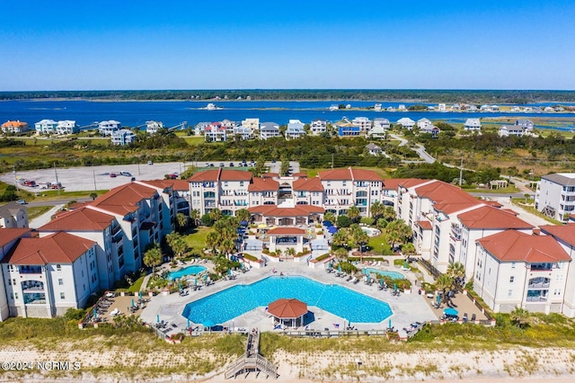 birds eye view of property featuring a water view