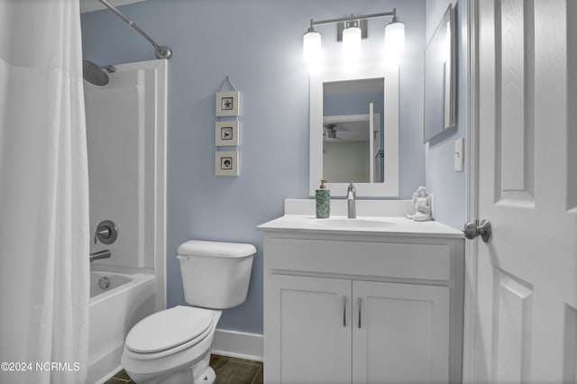 full bathroom featuring wood-type flooring, vanity, shower / bath combo with shower curtain, and toilet