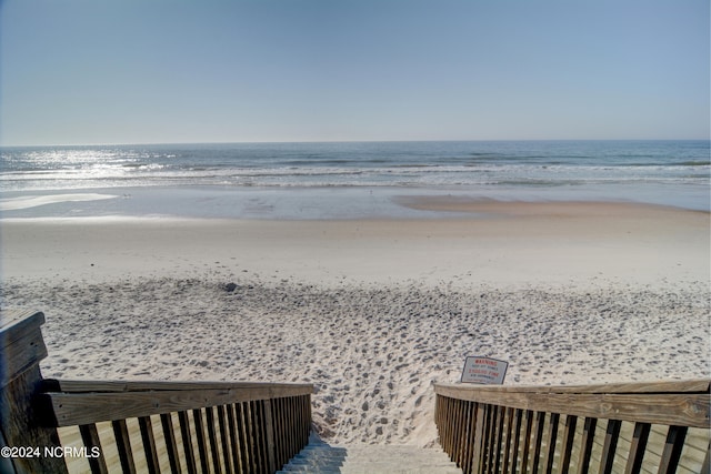 property view of water featuring a beach view