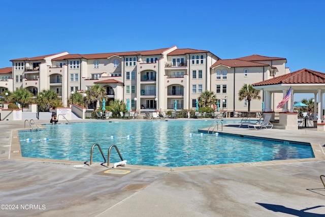 view of swimming pool featuring a patio area