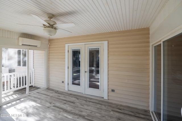 wooden deck with ceiling fan, french doors, and a wall mounted air conditioner