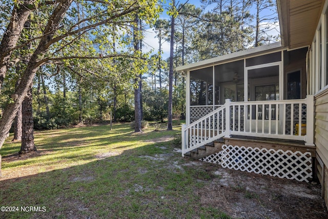 view of yard with a sunroom