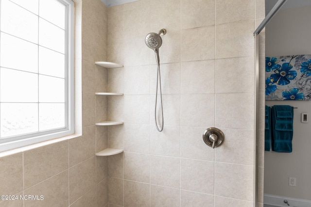 bathroom featuring tiled shower