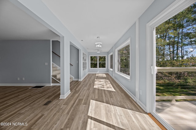 hall with light hardwood / wood-style floors