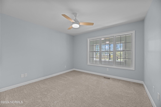 empty room with carpet and ceiling fan