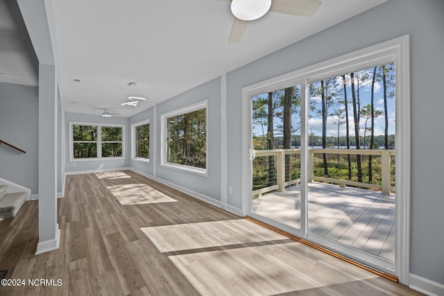 interior space featuring wood-type flooring and ceiling fan