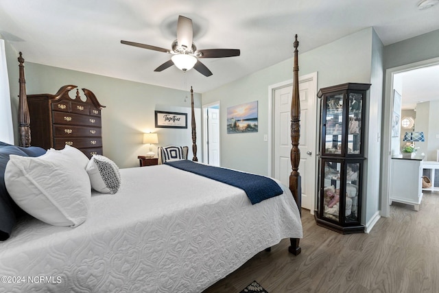 bedroom with ceiling fan and hardwood / wood-style floors