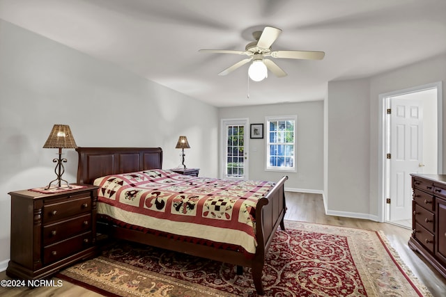 bedroom with light wood-type flooring and ceiling fan