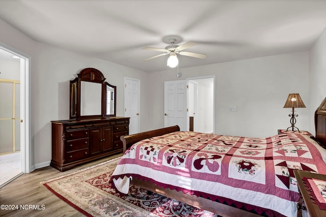 bedroom featuring light wood-type flooring and ceiling fan