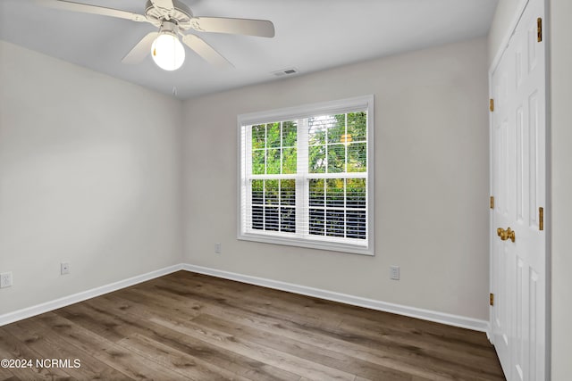 unfurnished room featuring hardwood / wood-style floors and ceiling fan