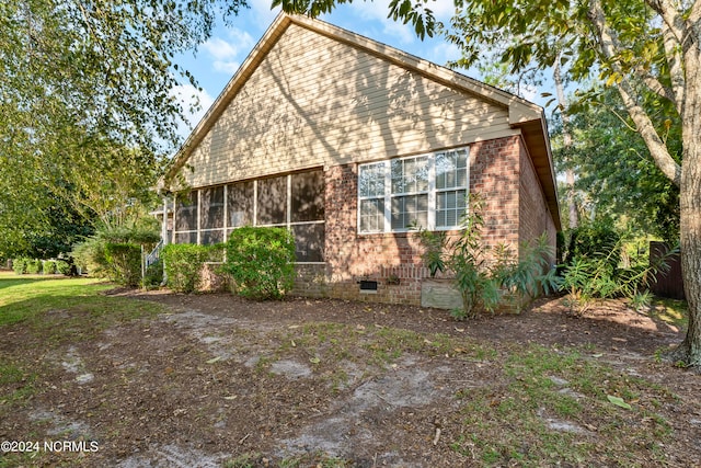 exterior space with a sunroom