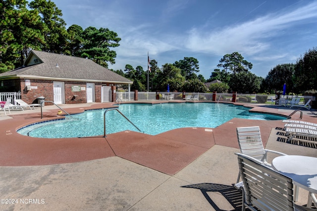 view of swimming pool with a patio area