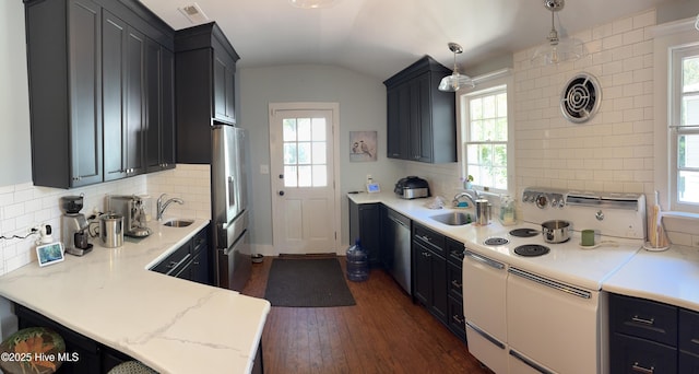 kitchen featuring pendant lighting, appliances with stainless steel finishes, sink, and plenty of natural light