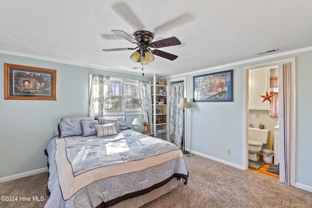 bedroom with a textured ceiling, ceiling fan, carpet floors, and ensuite bathroom