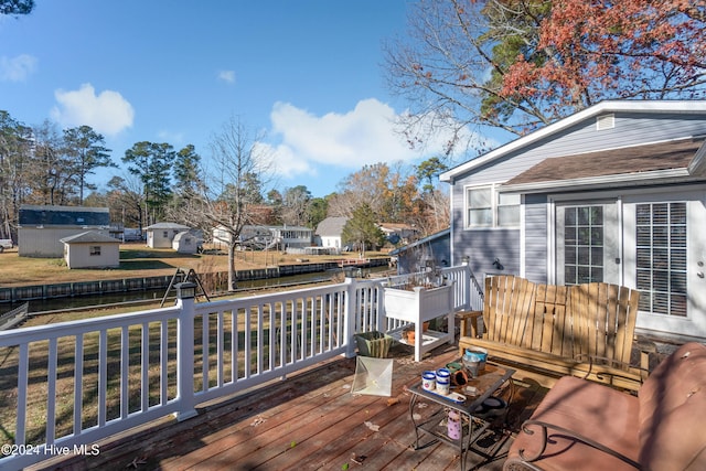 deck featuring a water view