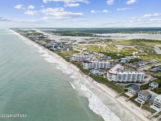 bird's eye view featuring a beach view and a water view