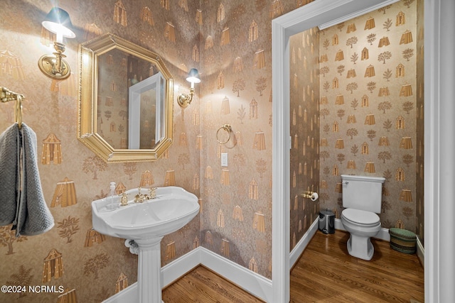 bathroom featuring toilet and hardwood / wood-style floors