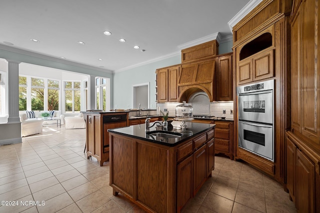 kitchen with sink, an island with sink, kitchen peninsula, stainless steel double oven, and crown molding