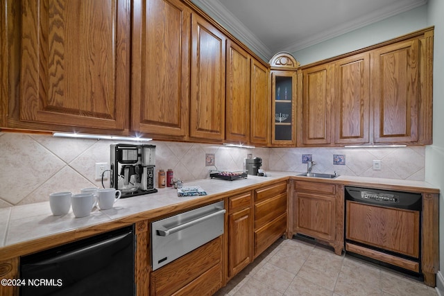 kitchen featuring dishwasher, sink, decorative backsplash, tile countertops, and crown molding