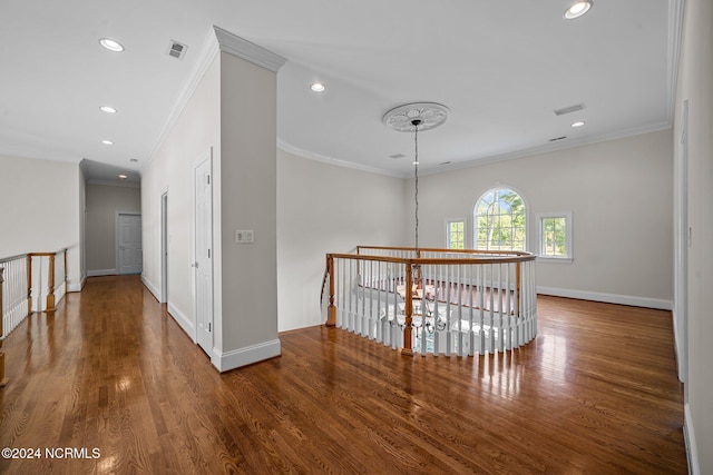 hall featuring crown molding and wood-type flooring