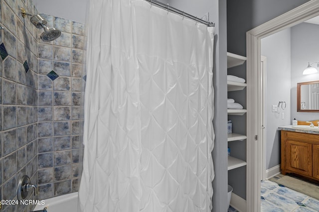 bathroom with tile patterned floors, shower / tub combo, and sink