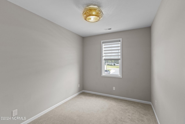 spare room featuring carpet floors