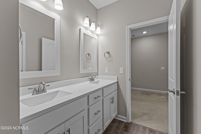 bathroom featuring vanity and wood-type flooring