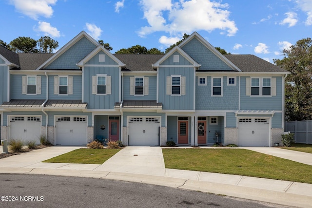 view of front of home featuring a garage and a front yard