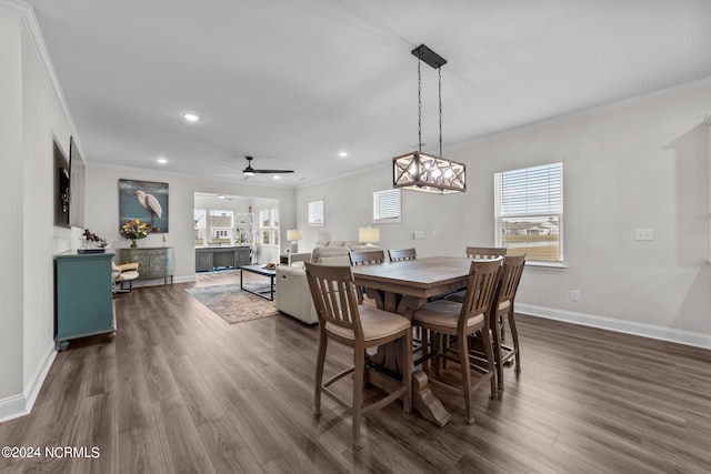 dining space featuring ornamental molding, dark hardwood / wood-style floors, and ceiling fan