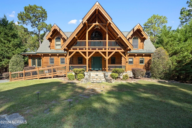 log home featuring a front yard