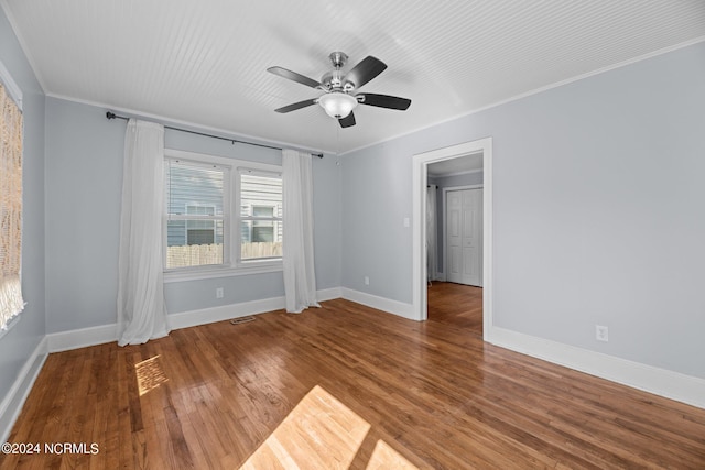 unfurnished room featuring ornamental molding, ceiling fan, and hardwood / wood-style flooring