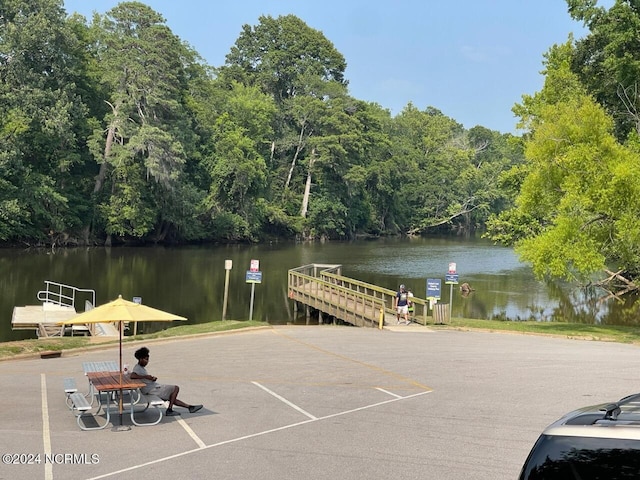 view of dock with a water view