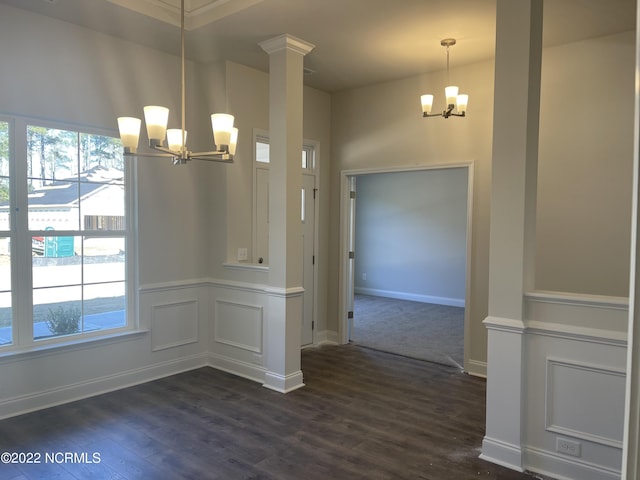 unfurnished dining area featuring an inviting chandelier and dark wood-type flooring