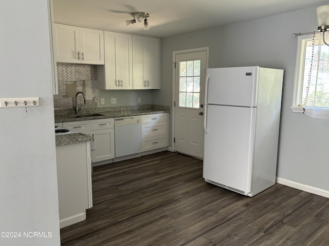 kitchen with white appliances, sink, dark hardwood / wood-style flooring, white cabinetry, and backsplash