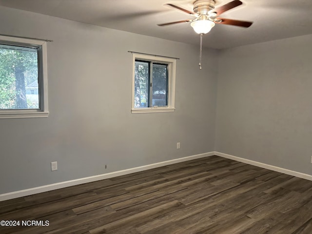 unfurnished room featuring ceiling fan, plenty of natural light, and dark hardwood / wood-style floors