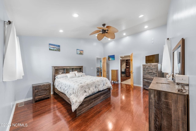 bedroom featuring high vaulted ceiling, a spacious closet, ceiling fan, and dark hardwood / wood-style floors