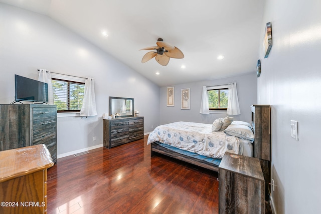 bedroom featuring dark hardwood / wood-style floors, vaulted ceiling, and ceiling fan