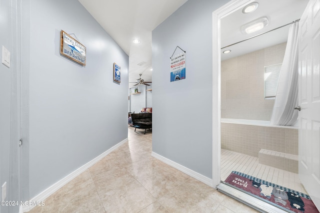 corridor featuring light tile patterned floors