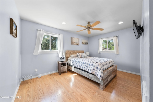 bedroom featuring ceiling fan and light wood-type flooring